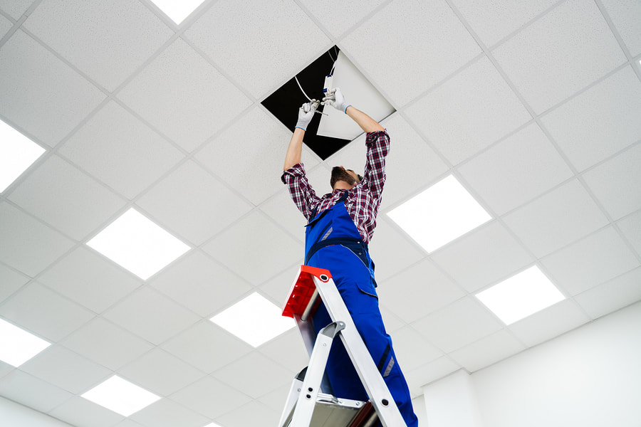 man fixing a ceiling