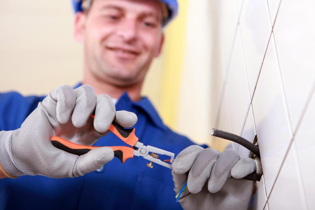 man fixing electrical wires